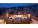 Cozy outdoor patio with fire pit and comfortable seating, perfect for enjoying evenings with mountain views at 8310 Raphael Ln, Littleton, CO 80125