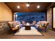 Beautiful covered patio with a stone fireplace and plush seating to enjoy the serene outdoor setting at 8310 Raphael Ln, Littleton, CO 80125