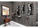 Elegant wine cellar showcasing a stylish wine rack, perfect for showcasing a curated wine collection with decorative wall art at 8310 Raphael Ln, Littleton, CO 80125