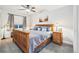 This bedroom has warm neutral tones and an abundance of natural lighting at 1882 W 67Th Ave, Denver, CO 80221