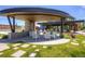 Outdoor community area featuring covered seating, green space, and playground at 1882 W 67Th Ave, Denver, CO 80221