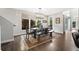 Bright dining room featuring stylish bench seating and lots of natural light from multiple windows at 1882 W 67Th Ave, Denver, CO 80221