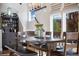 Inviting dining room with a large table, bench seating, and a stylish display cabinet at 1882 W 67Th Ave, Denver, CO 80221