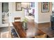 Elegant dining area with a wooden table, chairs, and modern chandelier at 1882 W 67Th Ave, Denver, CO 80221