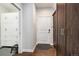 Entryway featuring hardwood floors, a white door and a closet system on the left and right at 1882 W 67Th Ave, Denver, CO 80221