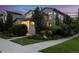 Inviting two-story home with well-maintained landscaping, sidewalk, and lush greenery at 1882 W 67Th Ave, Denver, CO 80221