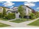 Modern two-story home with a well-maintained lawn and lush landscaping, showcasing curb appeal at 1882 W 67Th Ave, Denver, CO 80221