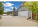 Two car garage with driveway and landscaped yard at 1882 W 67Th Ave, Denver, CO 80221