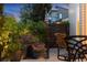 Landscaped gate with potted plants and chair at 1882 W 67Th Ave, Denver, CO 80221