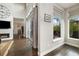 Bright living room with large windows, hardwood floors, and elegant neutral color palette at 1882 W 67Th Ave, Denver, CO 80221