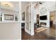 Sophisticated living room with high ceilings, hardwood floors, fireplace, and open layout design at 1882 W 67Th Ave, Denver, CO 80221