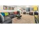 This living room includes a large sectional sofa and 2 armchairs at 1882 W 67Th Ave, Denver, CO 80221
