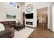 Spacious living room features a fireplace, large TV, and sleek modern design at 1882 W 67Th Ave, Denver, CO 80221