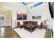 Bright living room with tall ceilings, modern decor, and comfortable leather sectional sofa at 1882 W 67Th Ave, Denver, CO 80221