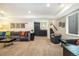 Living room with a wet bar, a large sectional sofa and 2 armchairs at 1882 W 67Th Ave, Denver, CO 80221