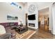 Spacious living room with high ceilings, modern fireplace, hardwood floors, and comfortable seating at 1882 W 67Th Ave, Denver, CO 80221