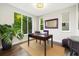 Bright home office with large windows offering a pleasant view and comfortable workspace at 1882 W 67Th Ave, Denver, CO 80221