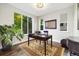 Bright home office featuring a large window, hardwood floors, and a comfortable workspace at 1882 W 67Th Ave, Denver, CO 80221