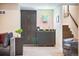 There is a modern wet bar off of the living room with stairs nearby at 1882 W 67Th Ave, Denver, CO 80221