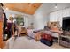 This bedroom features a slanted wooden ceiling with a bed and a desk in the room at 26526 Gray Buck Trl, Conifer, CO 80433
