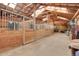 This is the interior of a horse stable with multiple stalls for the horses at 26526 Gray Buck Trl, Conifer, CO 80433