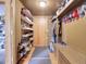 This mud room has plenty of storage and organization space with shelving, hooks, and a bench at 26526 Gray Buck Trl, Conifer, CO 80433