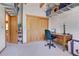 This office features an abundance of storage with wooden cabinets and shelves around the room at 26526 Gray Buck Trl, Conifer, CO 80433