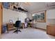 This office features an abundance of storage and natural light with the view of the outdoors at 26526 Gray Buck Trl, Conifer, CO 80433