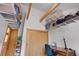 This office has lots of storage and shelving with a natural wood ceiling at 26526 Gray Buck Trl, Conifer, CO 80433