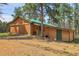 Spacious outbuilding with large doors, perfect for storage or workshop at 26526 Gray Buck Trl, Conifer, CO 80433