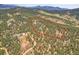 Aerial outline highlights property boundaries, showing the expansive lot and surrounding natural landscape at 26526 Gray Buck Trl, Conifer, CO 80433