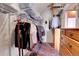 Spacious walk-in closet with shelving, hanging rods, and organized storage at 26526 Gray Buck Trl, Conifer, CO 80433