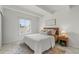 Comfortable bedroom featuring a queen-sized bed, natural light, and stylish decor at 9725 E Harvard Ave # 323, Denver, CO 80231