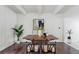 Dining area boasts a modern table, stylish chairs, modern art, and ample natural light at 9725 E Harvard Ave # 323, Denver, CO 80231