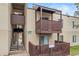 Neutral-toned condo building featuring stairs and exterior balconies, offering a blend of accessibility and outdoor living spaces at 9725 E Harvard Ave # 323, Denver, CO 80231