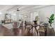 Inviting living and dining area boasts hardwood floors, ceiling fan, and abundant natural light at 9725 E Harvard Ave # 323, Denver, CO 80231