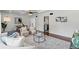 Cozy open-concept living space with modern furniture, decor, and an adjacent dining area at 9725 E Harvard Ave # 323, Denver, CO 80231