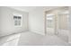 Bedroom with carpet, a window, and view of another room at 7376 Watercress Dr, Littleton, CO 80125