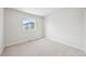 Bright bedroom with neutral carpet and a window offering natural light at 7376 Watercress Dr, Littleton, CO 80125