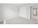 Cozy bedroom featuring plush carpet and a closet with sliding doors at 7376 Watercress Dr, Littleton, CO 80125