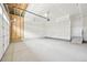 Spacious two-car garage featuring ample storage and an automatic door, ready for customization at 7376 Watercress Dr, Littleton, CO 80125