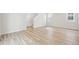 Bright living room features light hardwood flooring and neutral walls at 7376 Watercress Dr, Littleton, CO 80125