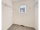 Functional walk-in closet with ample shelving and a window, maximizing storage and natural light at 374 N Geneva St, Aurora, CO 80010