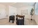 Stylish home office featuring a wooden desk, art, and large windows for natural light at 374 N Geneva St, Aurora, CO 80010