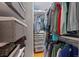 Walk-in closet with a shelving system and ample storage for clothes and accessories at 703 S Oneida Way, Denver, CO 80224