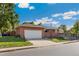 Charming single-story brick home features an attached garage and lush green lawn at 703 S Oneida Way, Denver, CO 80224
