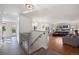 Bright living room with hardwood floors, a staircase, an open layout, and lots of natural light at 703 S Oneida Way, Denver, CO 80224