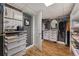 Bright walk-in closet with custom shelving and drawers for storage solutions at 703 S Oneida Way, Denver, CO 80224
