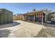 Spacious backyard featuring a shed and a covered patio area, great for outdoor entertainment at 7870 Kimberly St, Commerce City, CO 80022