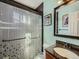 Bathroom with mosaic shower and framed mirror at 7870 Kimberly St, Commerce City, CO 80022